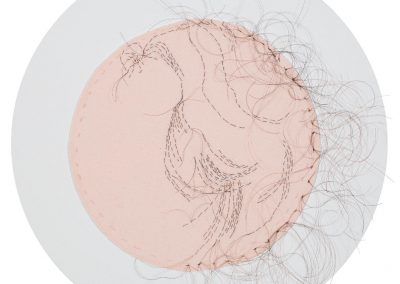 Ancestry of Anger detail of Betty Freidan, 2016, hand-sewn human hair on fabric, each 8” diameter